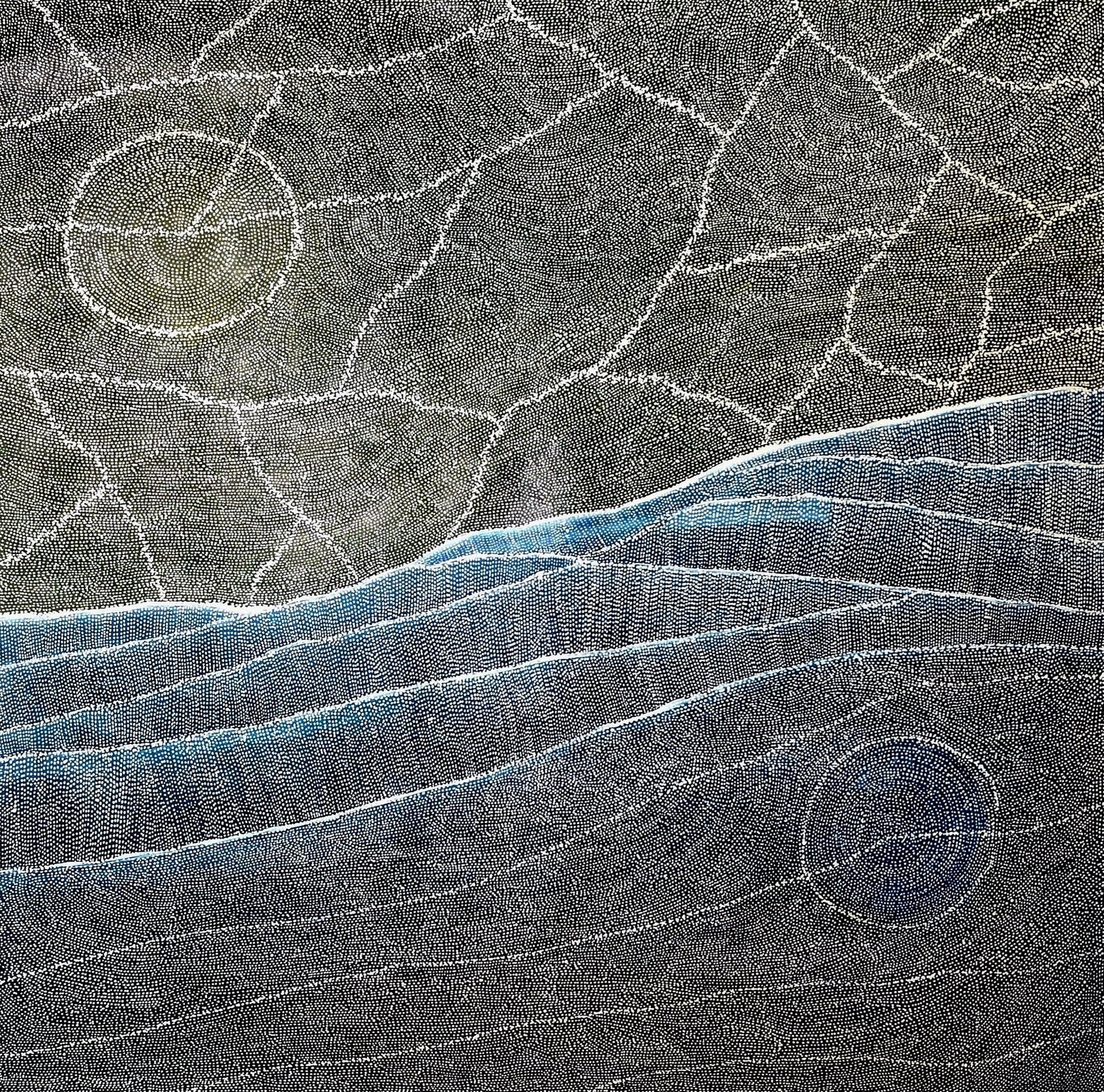 Aerial style dot painting with cracked ochre terrain above and sweeping blue dune lines below, two pale circular forms anchoring opposite corners.